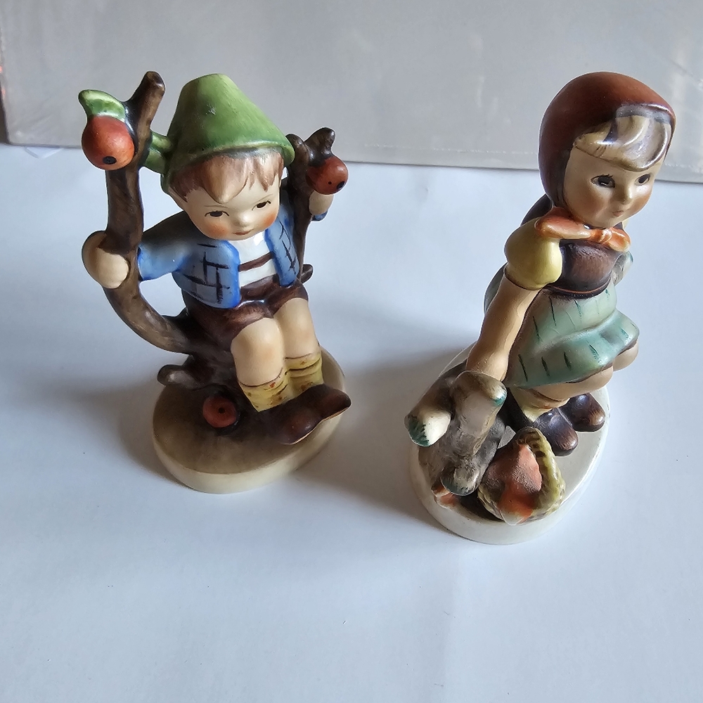 Vintage 1930s Hummel girl on fence with basket and boy in apple tree